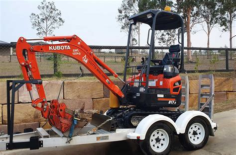 mini excavator on trailer|mini excavator and trailer packages.